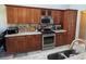 Updated kitchen featuring granite countertops, stainless steel appliances, and plenty of storage at 1235 Jasmine Green Ct, Dacula, GA 30019