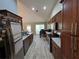 Bright kitchen with stainless steel appliances, granite countertops, wood cabinets and a dining area nearby at 1235 Jasmine Green Ct, Dacula, GA 30019