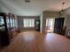 Bright living area with wood floors, plantation shutters, and convenient access to the home's entrance at 1235 Jasmine Green Ct, Dacula, GA 30019
