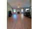 Inviting living room features wood floors, a cozy fireplace, and large windows for natural light at 1235 Jasmine Green Ct, Dacula, GA 30019