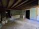 Unfinished basement, featuring cinder block foundation walls, concrete floor and doorway to backyard at 1846 Markone Nw St, Atlanta, GA 30318