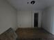 Renovation project showcasing a room with unfinished floors and exposed wiring at 1846 Markone Nw St, Atlanta, GA 30318