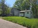 Charming two-story home with a covered front porch and mature landscaping, offering a serene and inviting curb appeal at 1846 Markone Nw St, Atlanta, GA 30318