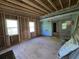 Unfinished living room area, with new construction framing, sliding glass doors and plywood floor at 1846 Markone Nw St, Atlanta, GA 30318