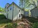 Back exterior view of home showcasing siding and backyard landscape at 1846 Markone Nw St, Atlanta, GA 30318
