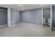 Finished basement featuring neutral carpeting and access to a bathroom at 2681 Tilson Rd, Decatur, GA 30032