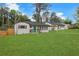 Charming home featuring a teal front door, inviting porch, well-manicured lawn, and carport at 2681 Tilson Rd, Decatur, GA 30032