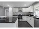 Modern kitchen featuring a sleek island, stainless steel appliances, and stylish backsplash at 2681 Tilson Rd, Decatur, GA 30032