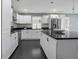 Modern kitchen featuring a sleek island, stainless steel appliances, and stylish backsplash at 2681 Tilson Rd, Decatur, GA 30032