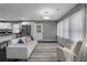 Bright living room featuring a comfortable couch, modern lighting, and an open floorplan at 2681 Tilson Rd, Decatur, GA 30032