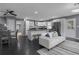 Bright living room with open floor plan flowing into kitchen and dining areas, modern appliances at 2681 Tilson Rd, Decatur, GA 30032