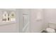 Bright bathroom with toilet and window featuring blinds, showcasing a clean and modern space at 290 Silver Moon Drive # 111, Loganville, GA 30052