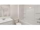 Full bathroom with shower-tub, mirror, and white vanity and toilet at 290 Silver Moon Drive # 111, Loganville, GA 30052