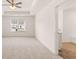 Spacious bedroom with a tray ceiling, fan, and lots of natural light at 290 Silver Moon Drive # 111, Loganville, GA 30052