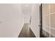 Hallway with wood floors and a glass front door at 290 Silver Moon Drive # 111, Loganville, GA 30052