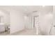 Bright hallway with carpeted floor leading to a bathroom and rooms, great natural light at 290 Silver Moon Drive # 111, Loganville, GA 30052