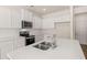 Kitchen island features stainless steel sink at 290 Silver Moon Drive # 111, Loganville, GA 30052