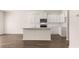 Bright kitchen featuring white cabinets and stainless steel appliances at 290 Silver Moon Drive # 111, Loganville, GA 30052