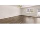 Living room with hardwood floors, ceiling fan and access to outdoor patio at 290 Silver Moon Drive # 111, Loganville, GA 30052