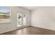 Bright living area with wood floors, access to the backyard, and a large window for natural light at 290 Silver Moon Drive # 111, Loganville, GA 30052