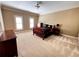 Serene bedroom with neutral tones, carpet flooring, and bright natural light at 9390 Colonnade Trl, Johns Creek, GA 30022