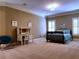 Spacious bedroom featuring carpet, a desk, and lots of natural light from windows with shutters at 9390 Colonnade Trl, Johns Creek, GA 30022