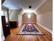 Attic bonus room with hardwood floors and a decorative carpet at 9390 Colonnade Trl, Johns Creek, GA 30022