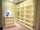 Walk-in closet with custom shelving, drawers, and plenty of room for organization and storage at 9390 Colonnade Trl, Johns Creek, GA 30022