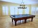 Game room featuring a classic billiard table, stylish lighting, and shuttered windows at 9390 Colonnade Trl, Johns Creek, GA 30022