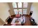 Aerial view of the living room featuring high ceilings, fireplace and expansive hardwood floors at 9390 Colonnade Trl, Johns Creek, GA 30022