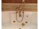 Close up of tub and gold-toned hardware at 9390 Colonnade Trl, Johns Creek, GA 30022