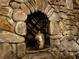 Decorated alcove with vase inside of stone walled wine cellar at 9390 Colonnade Trl, Johns Creek, GA 30022