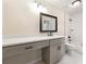 Modern bathroom featuring a gray vanity and marble tiled shower at 1371 Branch Dr, Tucker, GA 30084