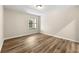 Bedroom with modern floors and natural light from window at 1371 Branch Dr, Tucker, GA 30084