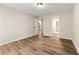 Spacious bedroom featuring sleek modern floors, neutral paint, and two doorway entrances at 1371 Branch Dr, Tucker, GA 30084