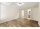 Large bedroom with wood flooring, three entryways and an overhead light fixture at 1371 Branch Dr, Tucker, GA 30084