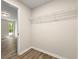Walk-in closet space with wire shelving and wood-look flooring at 1371 Branch Dr, Tucker, GA 30084