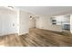 Open floor plan of the living room and kitchen area with wood-look floors at 1371 Branch Dr, Tucker, GA 30084