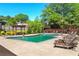 Community pool with lounge chairs and pergola sitting area at 1371 Branch Dr, Tucker, GA 30084