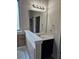 Bathroom showcasing a bathtub, vanity with dark cabinets, and ceramic tile surround at 1750 Stone Meadow Rd, Lithonia, GA 30058