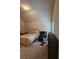 Bedroom features neutral walls, carpet, black metal bed frame, and a window providing natural light at 1750 Stone Meadow Rd, Lithonia, GA 30058