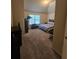 Bedroom with neutral carpet, natural light, and a matching bed spread at 1750 Stone Meadow Rd, Lithonia, GA 30058