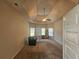 A well lit bedroom with neutral walls, carpet floors and tray ceiling at 1750 Stone Meadow Rd, Lithonia, GA 30058