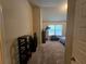Bedroom with neutral walls, carpet, ample natural light, and furnishings at 1750 Stone Meadow Rd, Lithonia, GA 30058
