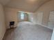 Large bonus room with neutral carpet and natural light from the window at 1750 Stone Meadow Rd, Lithonia, GA 30058