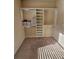 Functional walk-in closet with built-in shelving and racks, providing efficient storage solutions at 1750 Stone Meadow Rd, Lithonia, GA 30058