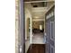 Inviting entryway with hardwood floors and open view to the living room at 1750 Stone Meadow Rd, Lithonia, GA 30058