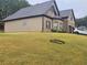 Beautiful home featuring brick accents, an attached two-car garage and lawn at 1750 Stone Meadow Rd, Lithonia, GA 30058