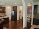 Open kitchen boasts stainless steel appliances, granite countertops, and dark wood cabinets at 1750 Stone Meadow Rd, Lithonia, GA 30058