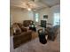 Comfortable living room features neutral carpet, fireplace, and plenty of natural light at 1750 Stone Meadow Rd, Lithonia, GA 30058